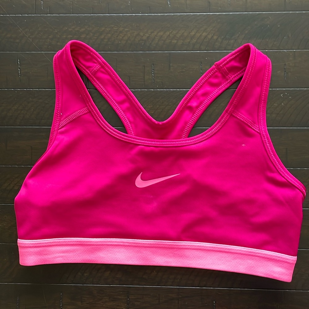 Nike dri fit size small sports bra.  Magenta and pink